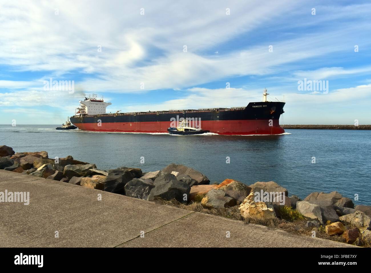 Cargo ship moves through coastal hi-res stock photography and images ...