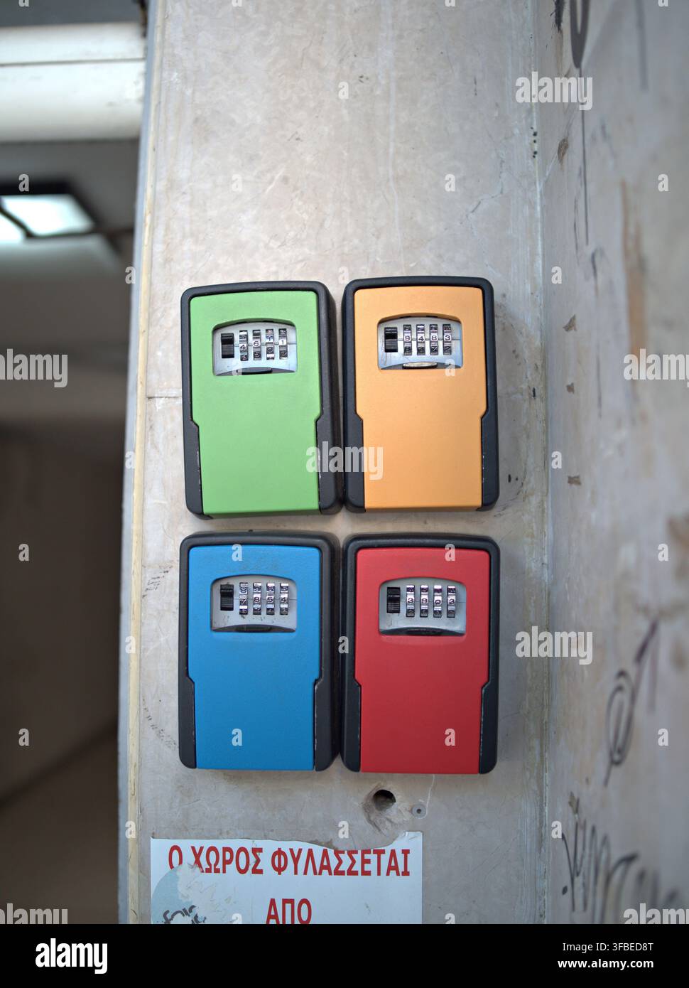 Key safe boxes mounted on a concrete wall Stock Photo