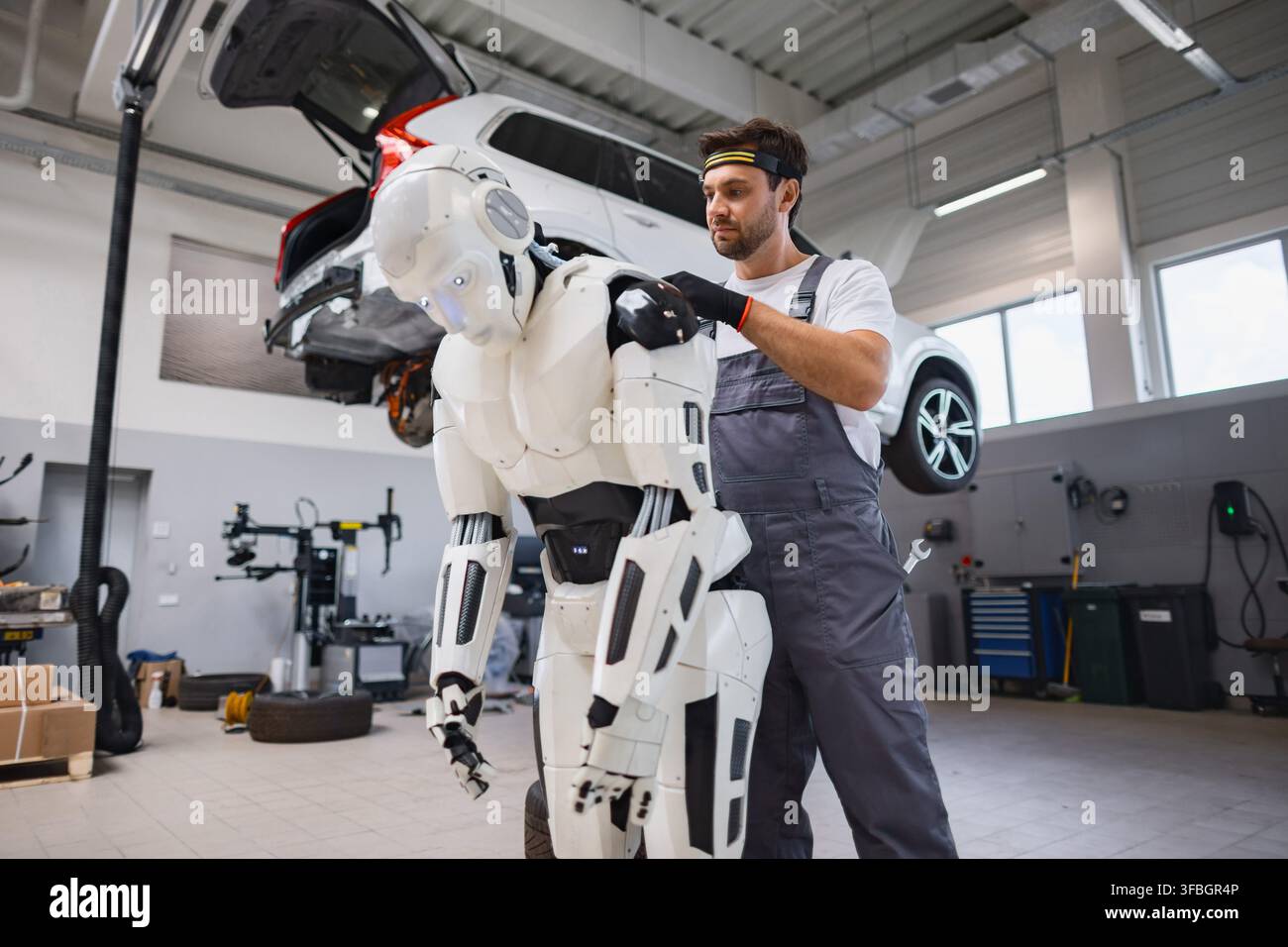 Mechanic Working On Robot Stock Photo
