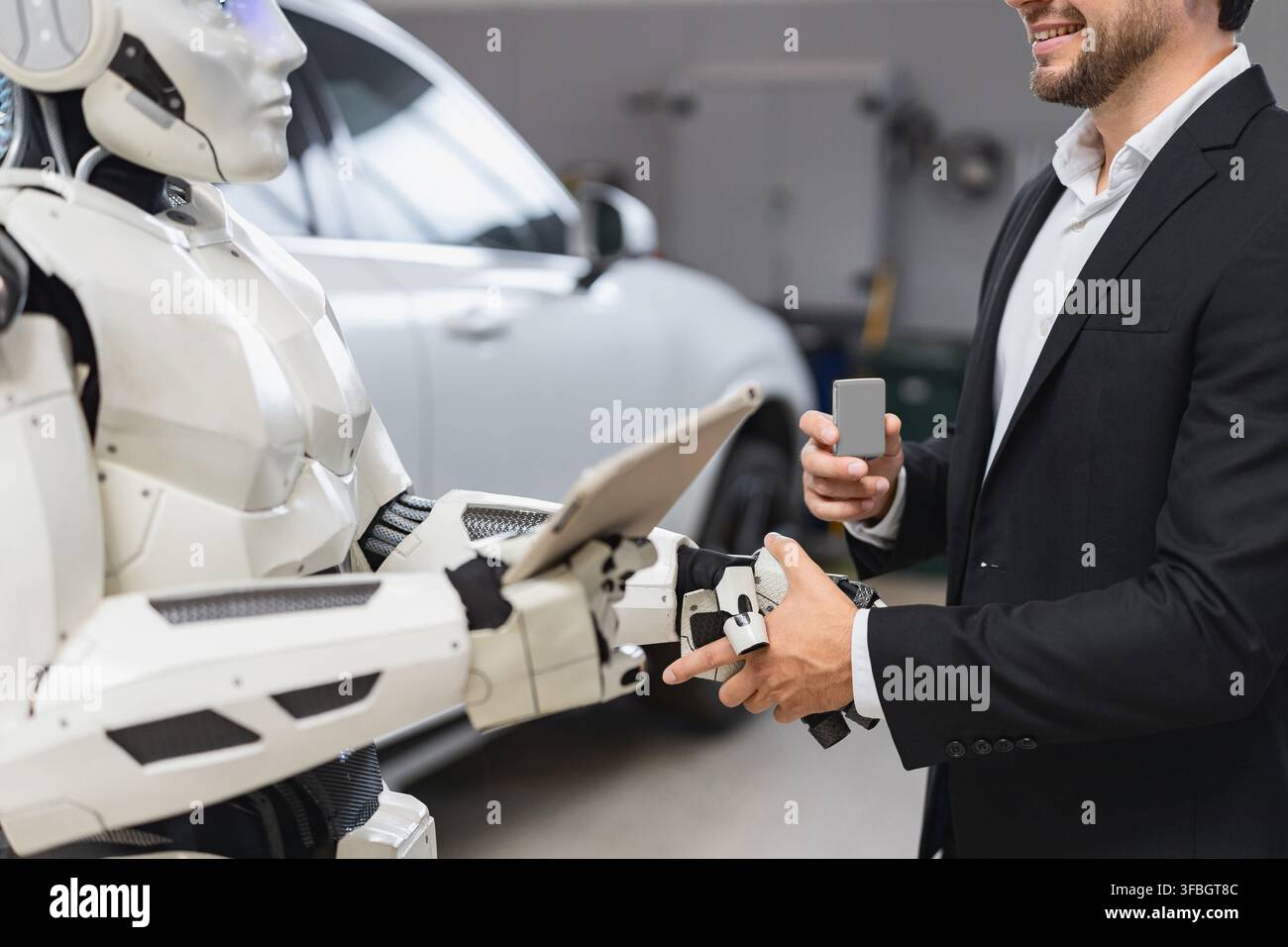 Man Shakes Hands With Robot Stock Photo