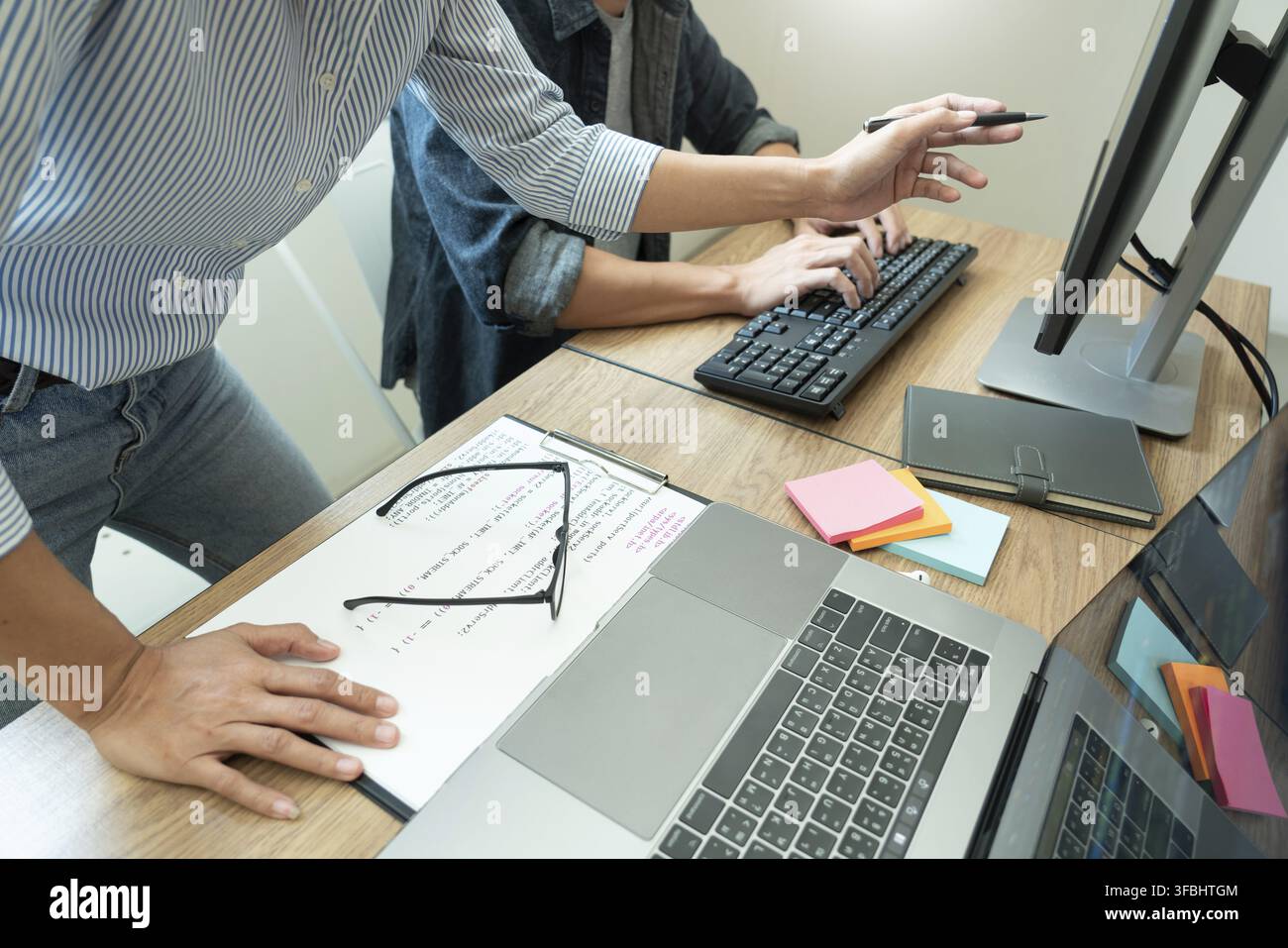 Collaborative work Software engineers website developer technologies or programmer working coding on startup ai application project on screen with par Stock Photo