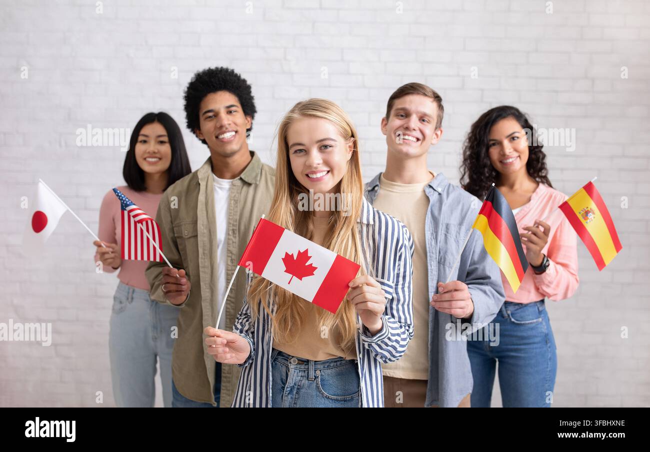 International exchange program and study together. Smiling young multi ethnic students looking at camera Stock Photo