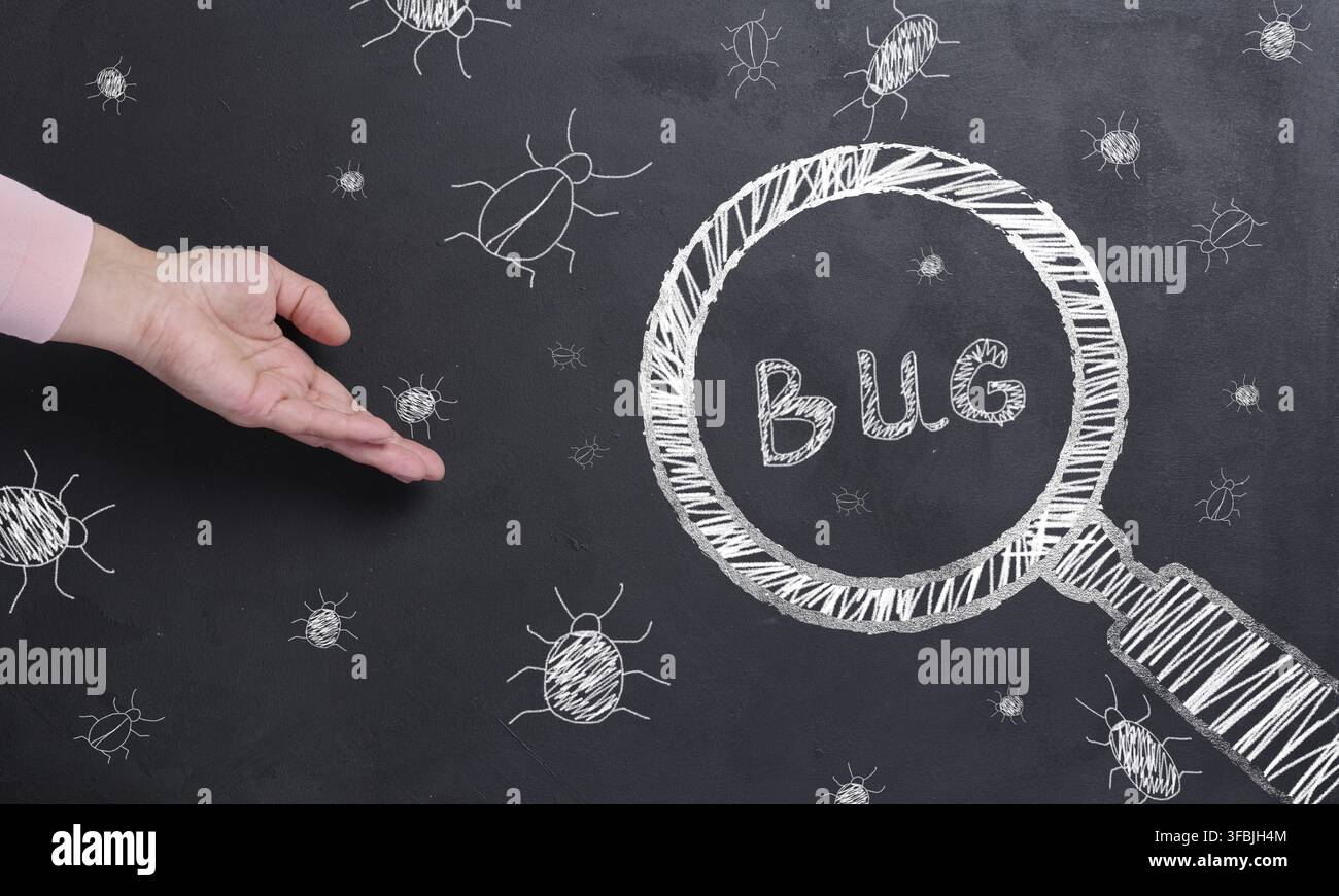 The process of finding and fixing bugs in software code Stock Photo