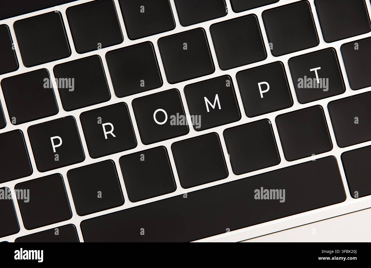 Computer keyboard showing keys spelling prompt, representing artificial intelligence, creativity, and idea generation through technology Stock Photo