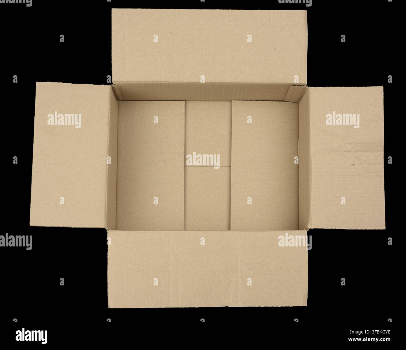 Open empty brown rectangular cardboard box for transporting goods isolated on a black background, top view Stock Photo