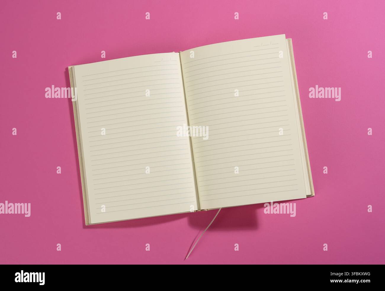 Open notebook with blank white sheets on pink background, top view Stock Photo