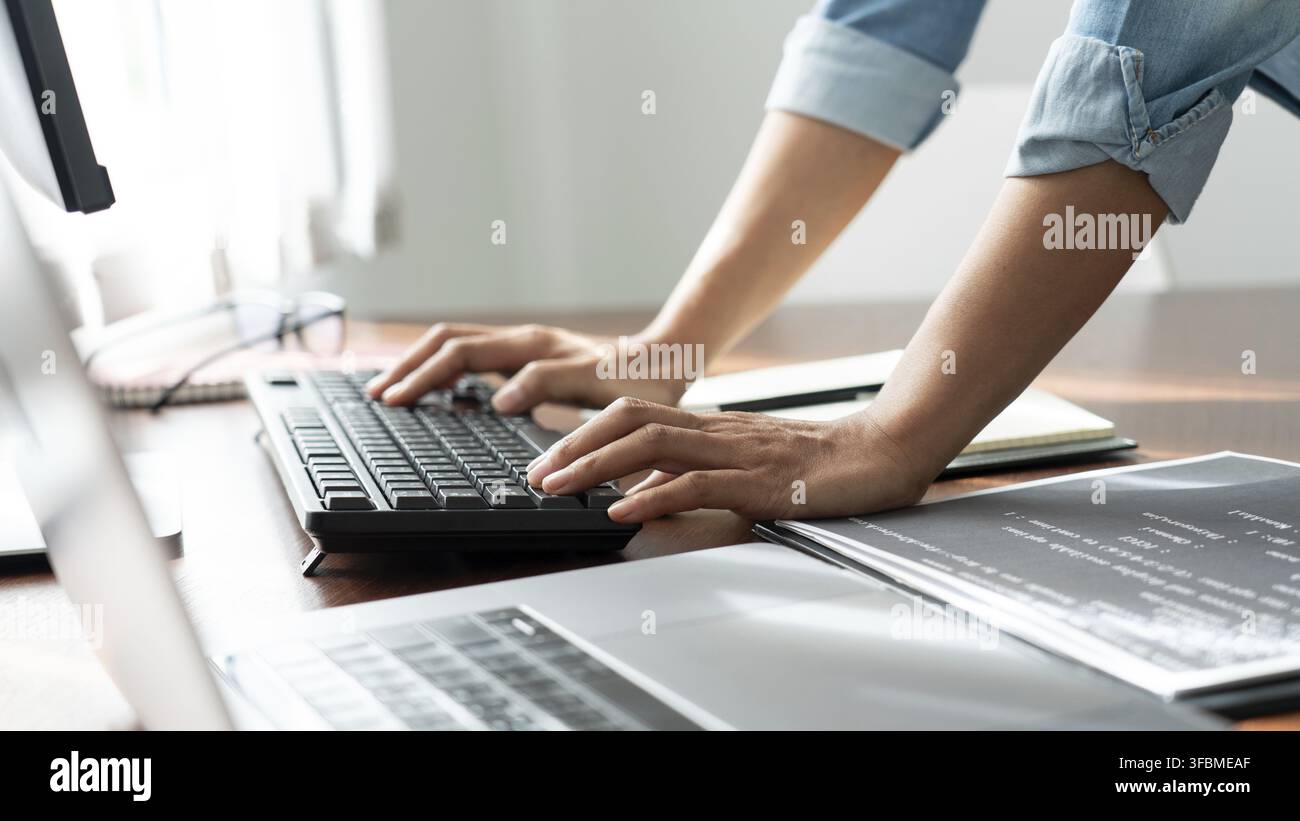Software developer or programmer working data debugging improvement binary algorithm on desktop pc in a software develop company office Stock Photo