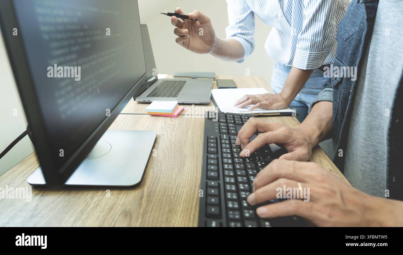 Collaborative work Software engineers website developer technologies or programmer working coding on startup ai application project on screen with par Stock Photo