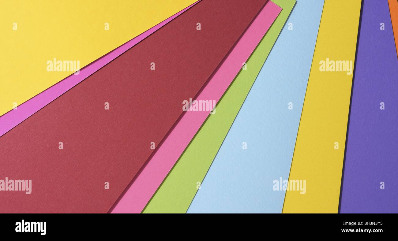 Abstract bright background from multicolored paper, backdrop for designer, copy space Stock Photo