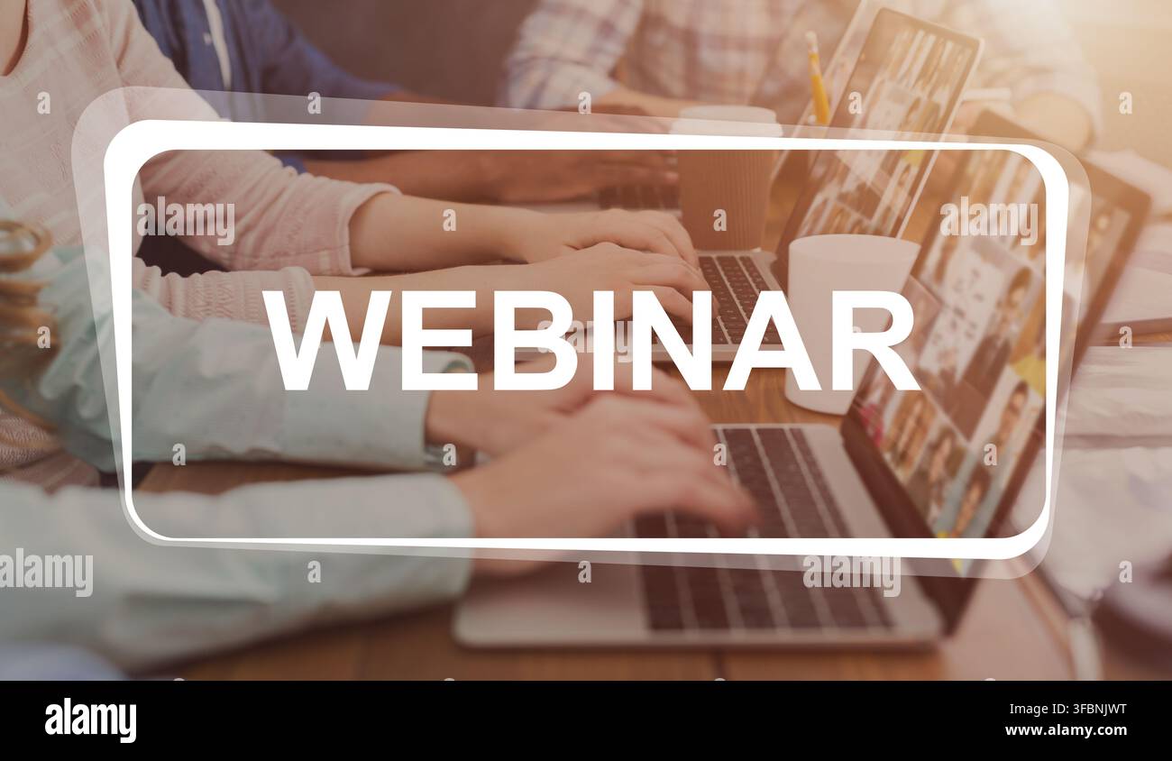 Webinar text over programmers working in software developing company Stock Photo