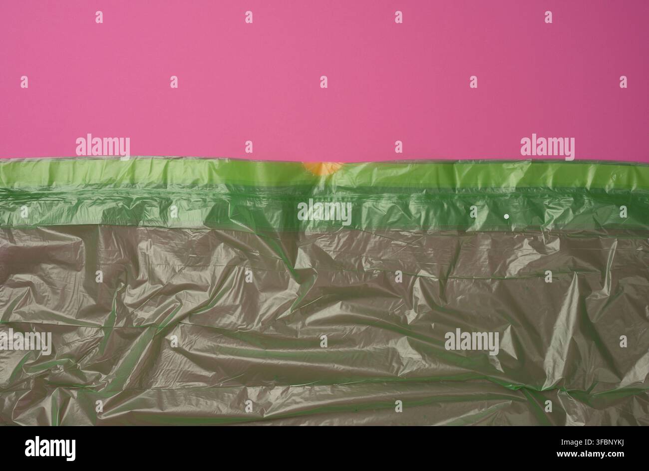 Crumpled green polyethylene texture, close up, full frame Stock Photo