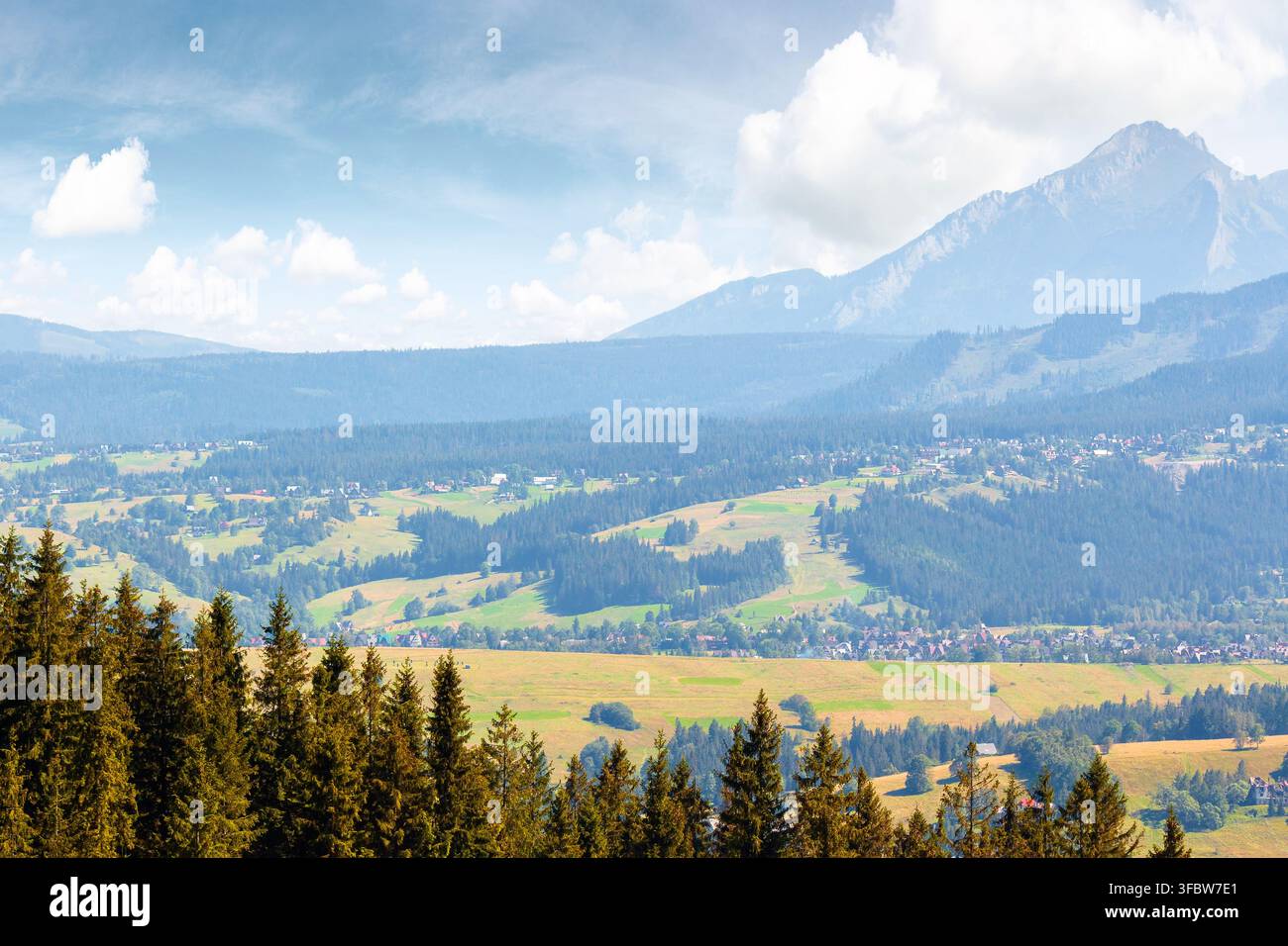 mountain landscape of Poland in late summertime. wonderful view of High Tatra ridge above Zakopane village valley. vacation place in Europe Stock Photo