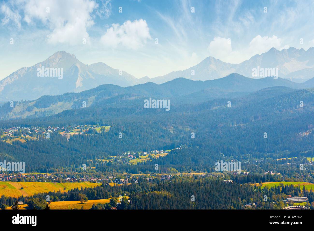 mountain landscape of Poland in late summertime. wonderful view of High Tatra ridge above Zakopane village valley. vacation place in Europe Stock Photo