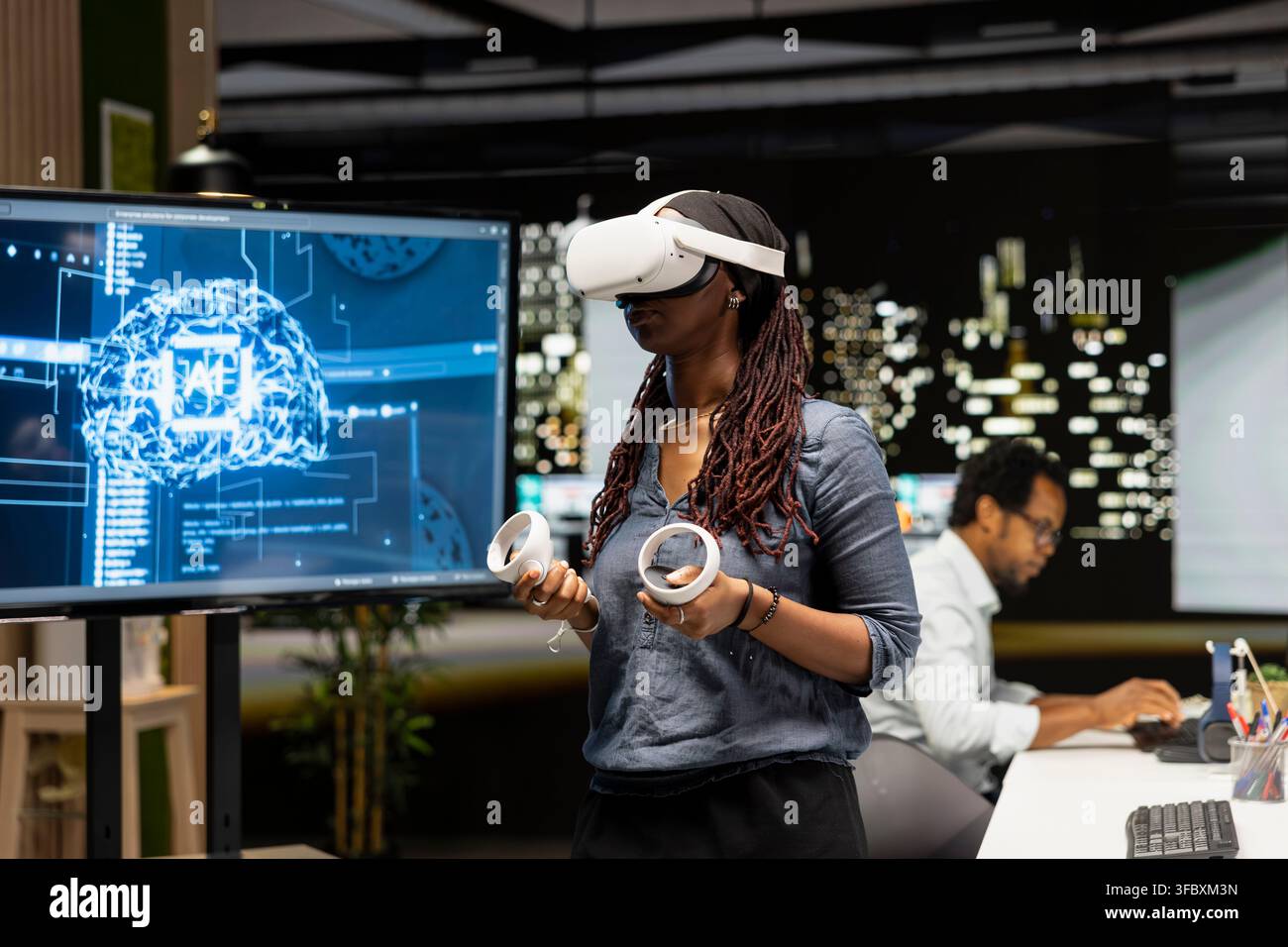 Woman using virtual reality in tech startup office to develop programs using AI automation. IT specialist wearing VR headset gear, debugging applications with artificial intelligence Stock Photo