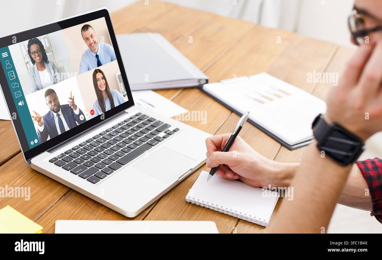 Man having video conference with team while working from home Stock Photo
