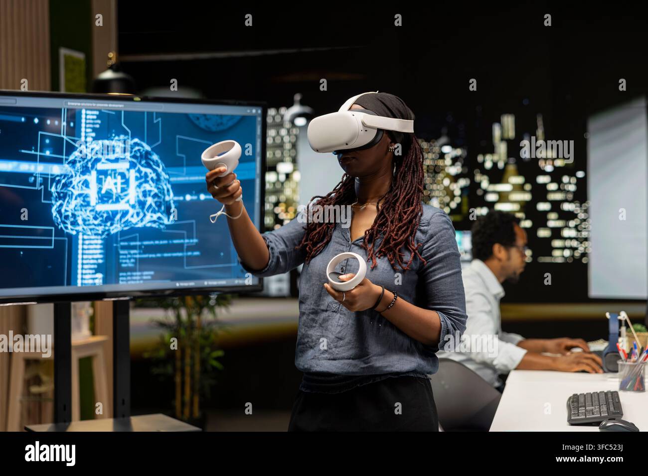 Engineer using virtual reality technology to write code, developing deep learning APIs. Tech startup worker using VR headset to troubleshoot software errors using artificial intelligence Stock Photo