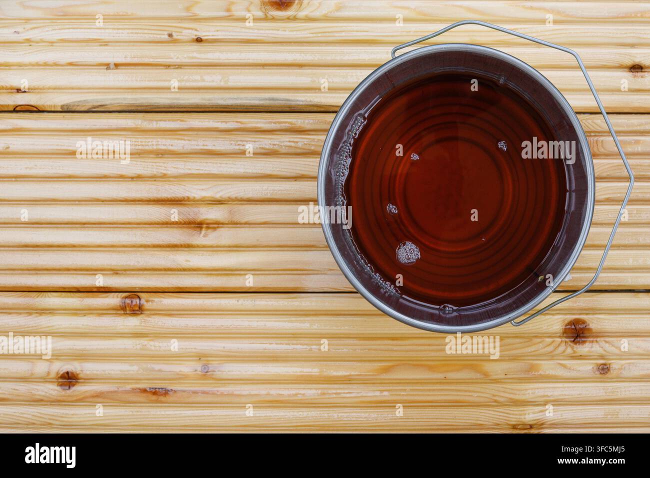 Special waterproof protective oil on larch floor as pattern or background. Copy space. View from above. Stock Photo