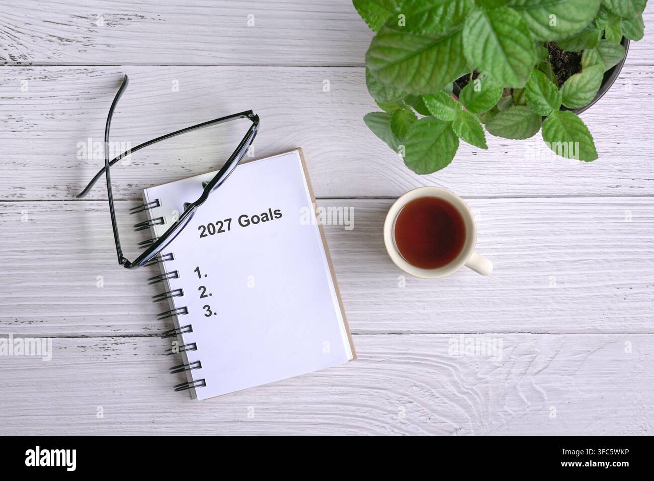 2027 goals with list on open notebook. Top view. Stock Photo