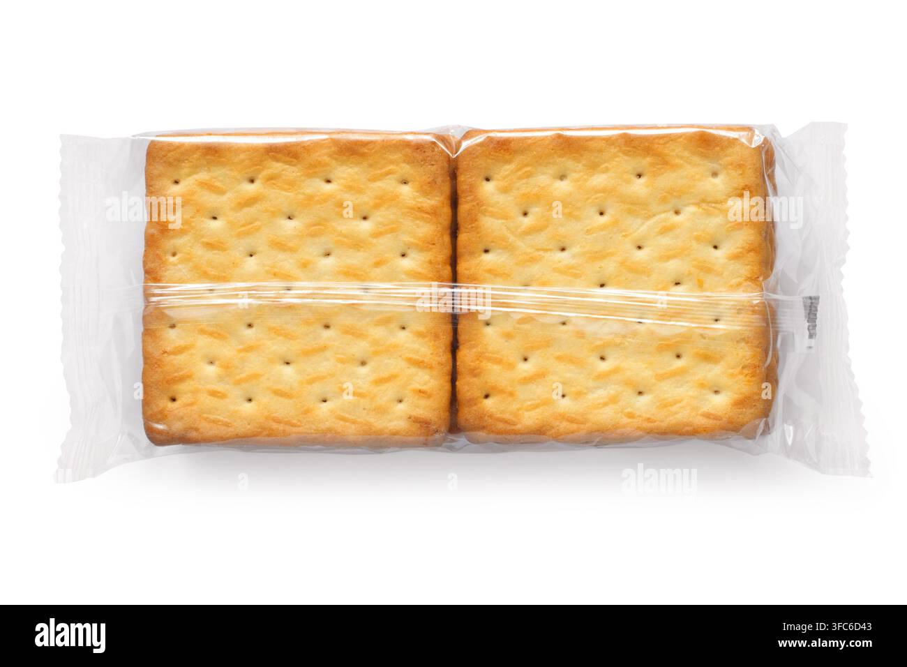 Cracker cookies in transparent packaging. Cracker packaging on a white background. Stock Photo