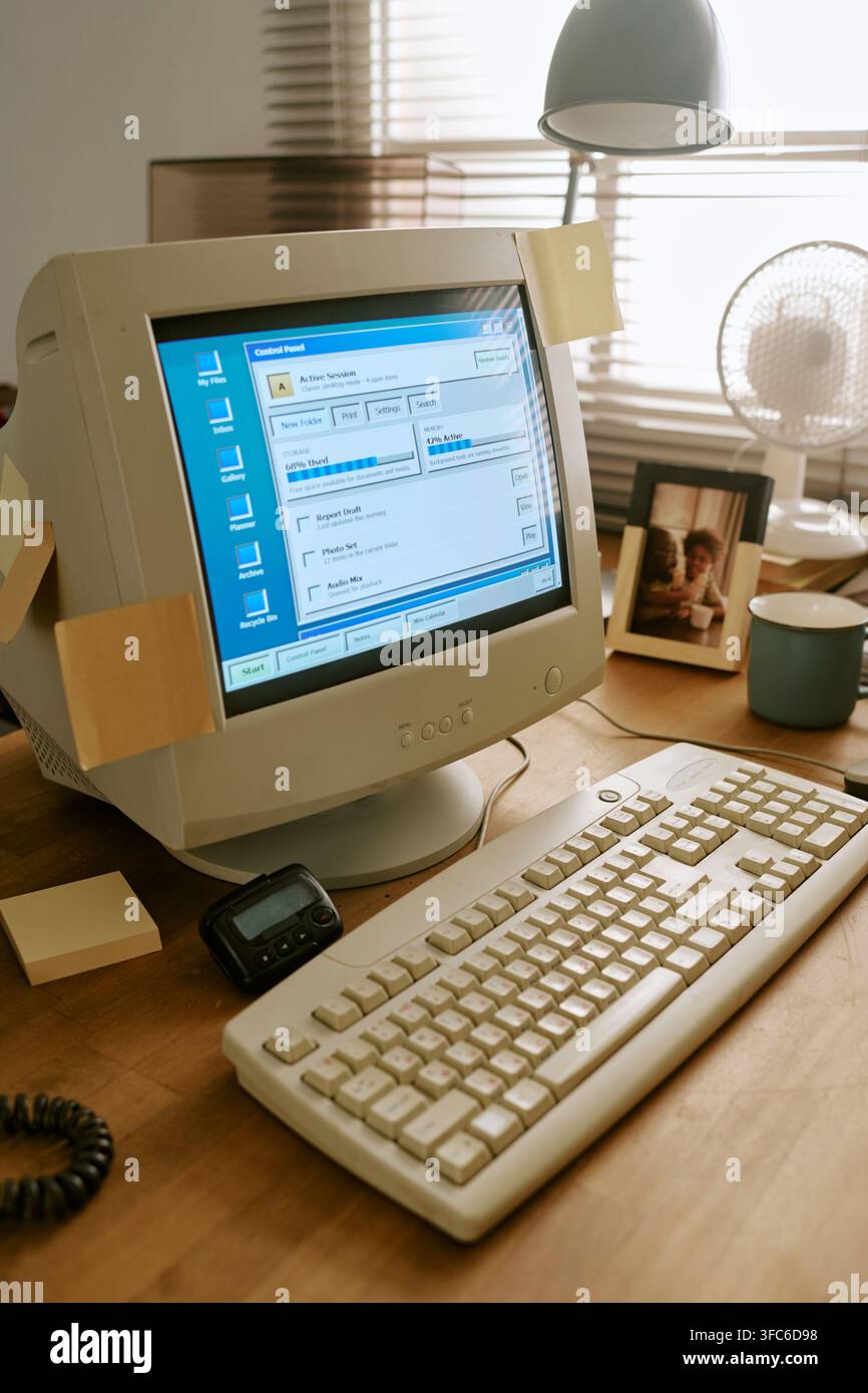 Retro Computer on Desk in Vintage Office Workspace Stock Photo