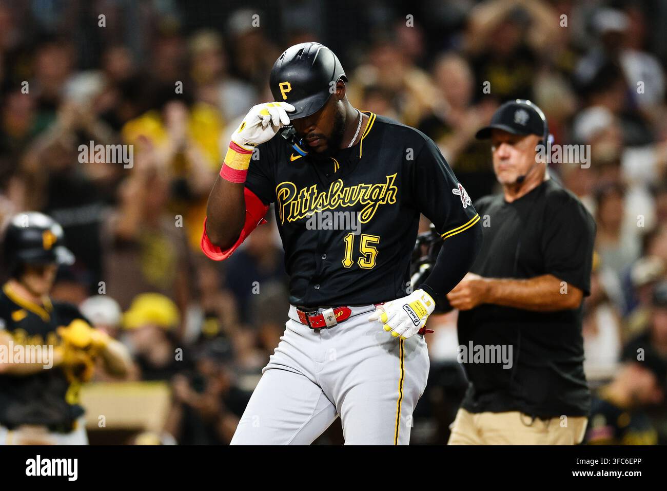 Pittsburgh Pirates' Oneil Cruz gestures as he crosses home plate after