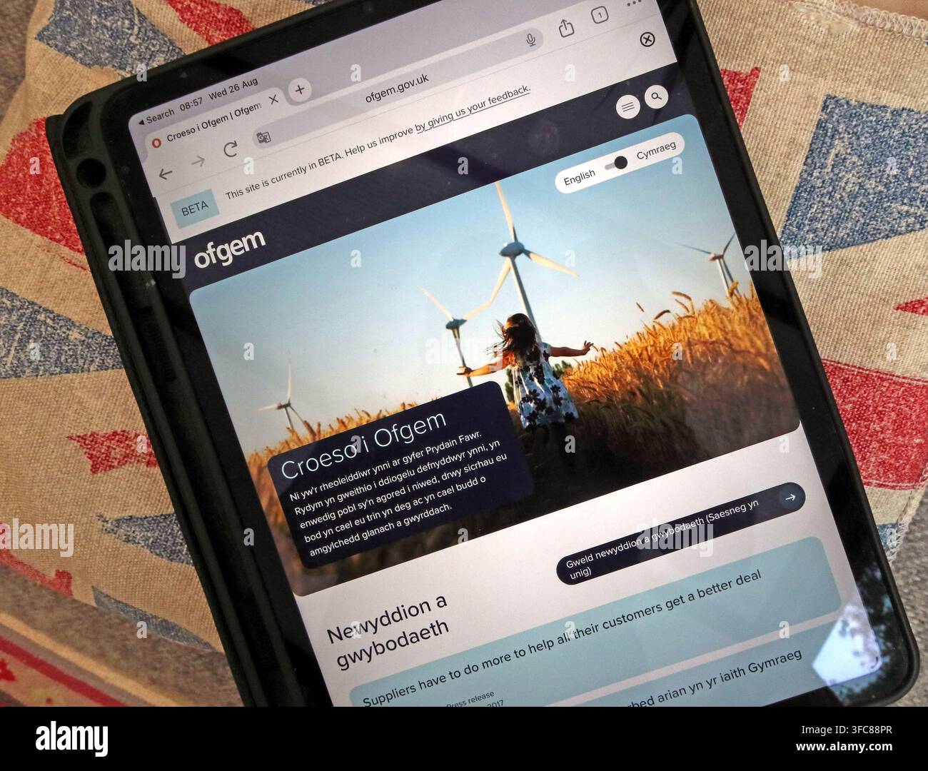 Ofgem website displayed in Welsh on a tablet, showing bilingual public information from Great Britain’s energy regulator. Stock Photo
