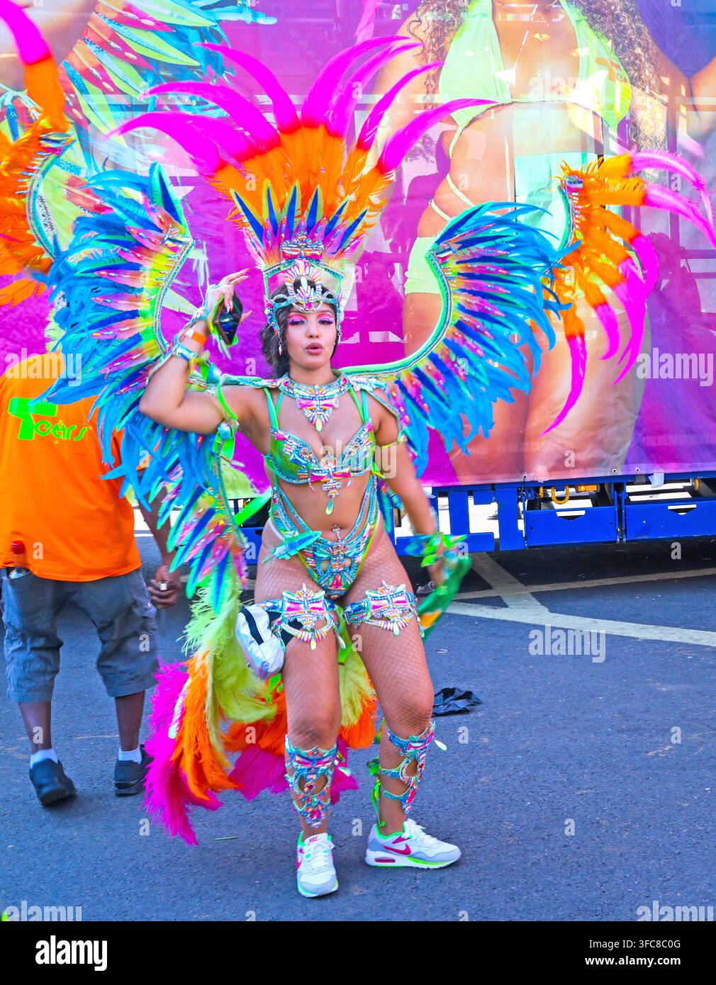 Female Tears Mas masquerader in an elaborate feathered frontline costume at Notting Hill Carnival 2025. Stock Photo