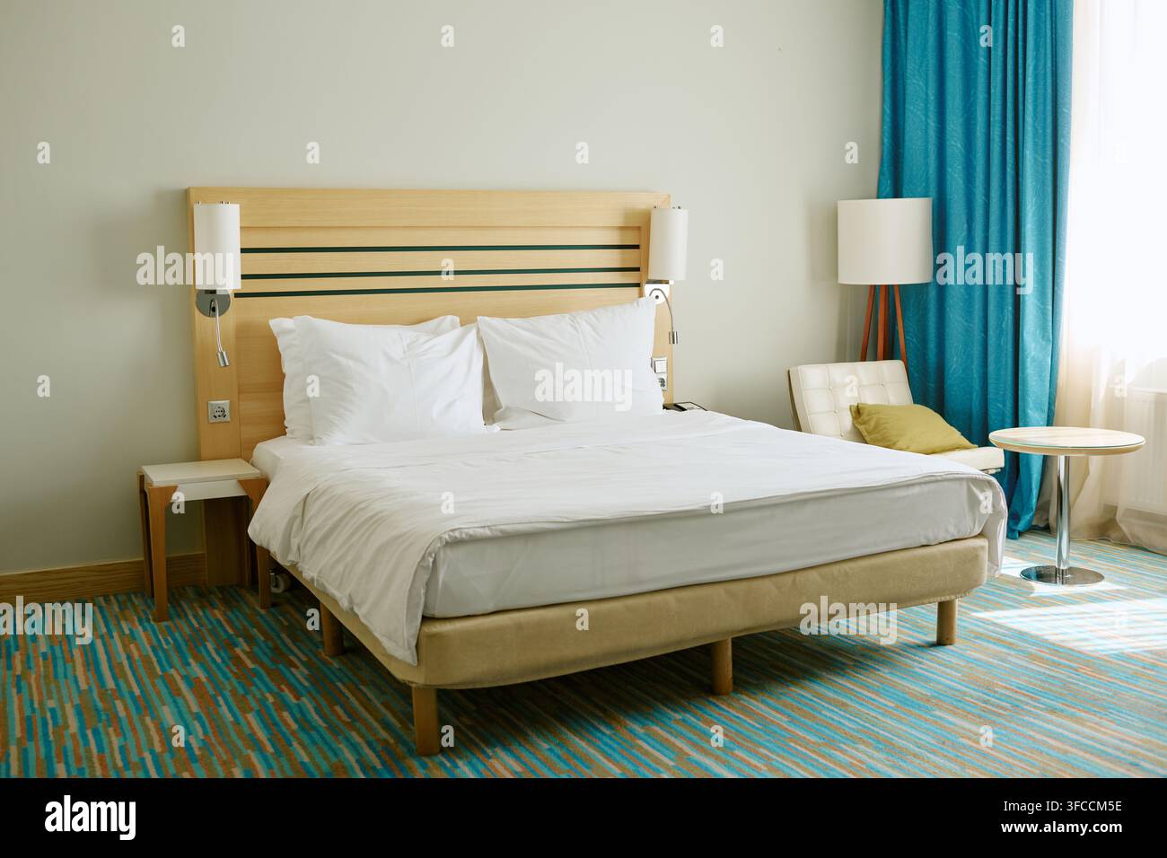 Empty Double Bed in Modern Hotel Room Ready for Guests Stock Photo