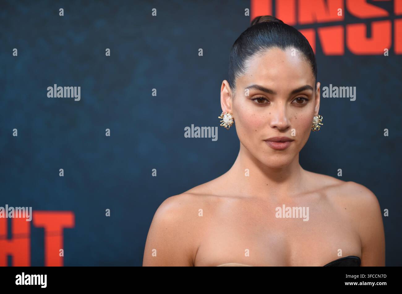 Adria Arjona arrives at the premiere of "Onslaught" on Wednesday, Aug