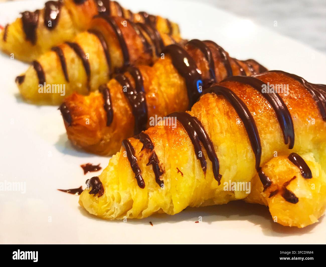 Four Manolitos. Typical puff pastry cakes. Stock Photo