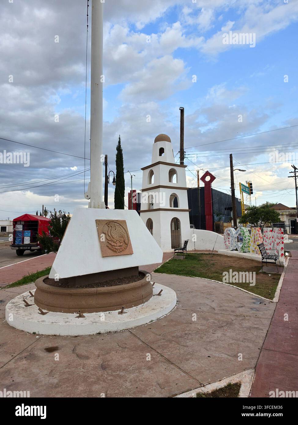Marker near a flag pole on Parque Bienvenida in Naco Sonora Mexico - Smartphone Captured Stock Image