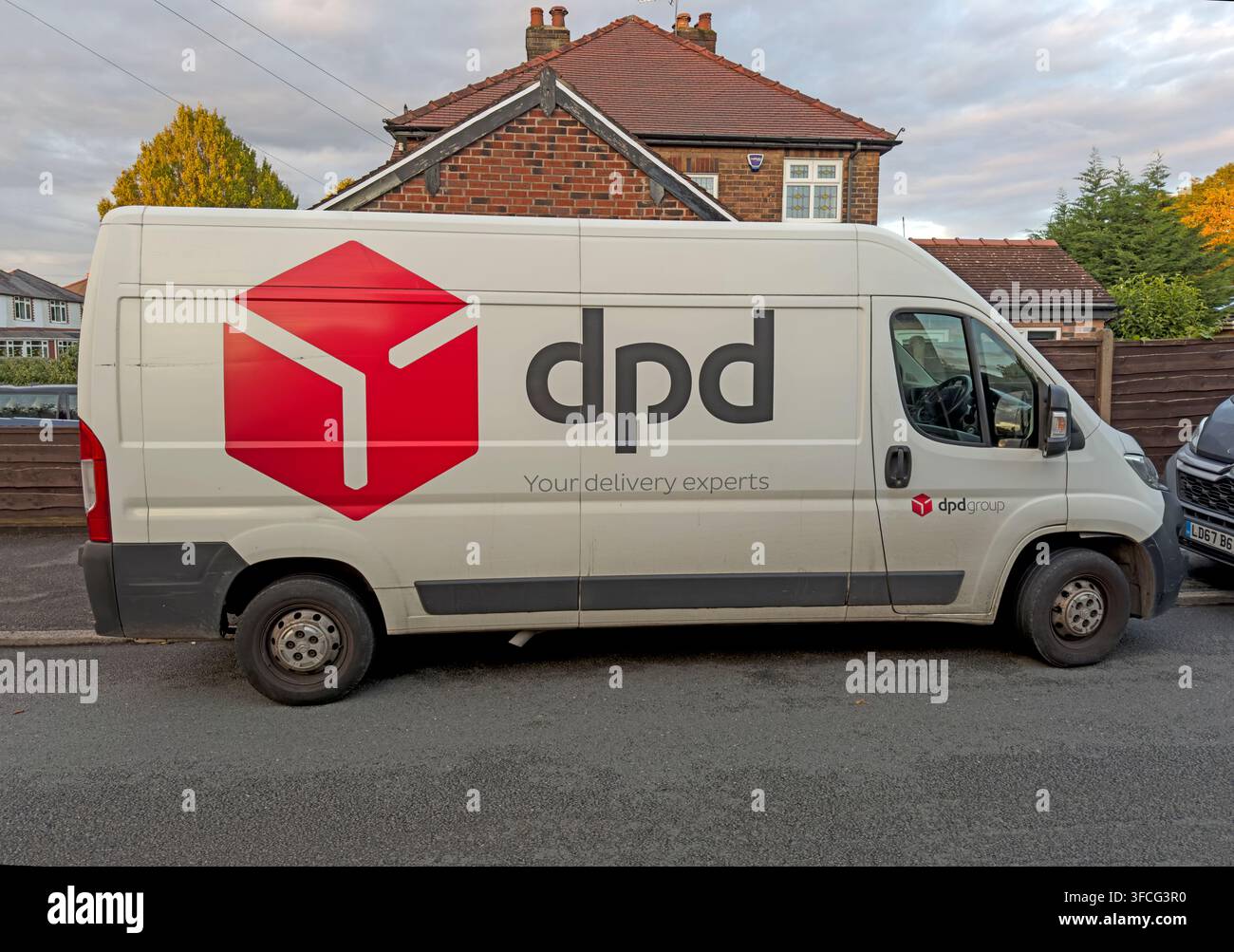 DPD parcel delivery van on a residential last-mile round in Britain, illustrating online shopping logistics Stock Photo