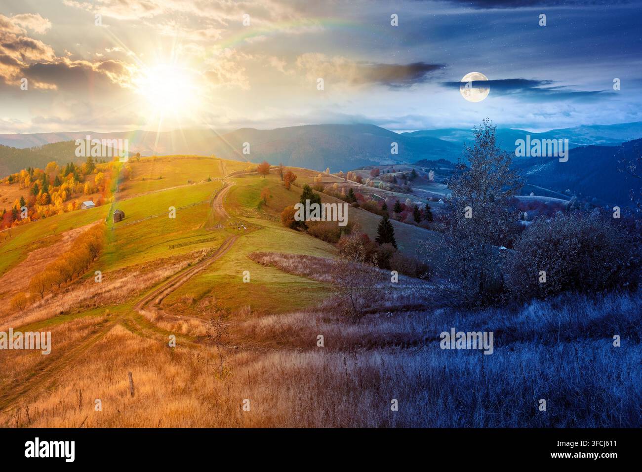 winding rural dirt path through hill. rolling countryside of ukraine on autumn equinox. cloudy sky at twilight. carpathian mountains in fall searon Stock Photo