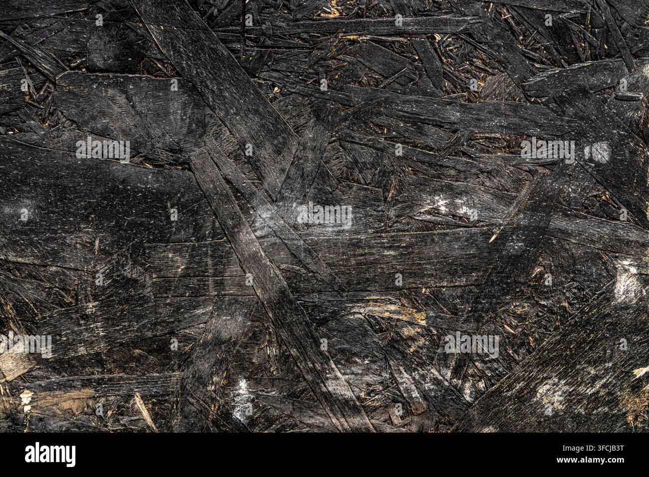 Black painted oriented strand board OSB wood texture. Stock Photo