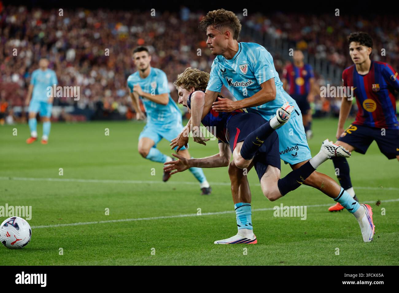 barcelona-s-marc-casado-left-and-barcelona-s-andreas-christensen