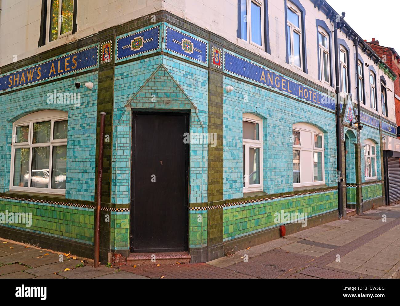 Corner view of Shaw’s Ales tiled frontage on the former Angel Hotel in Ashton-under-Lyne. Stock Photo