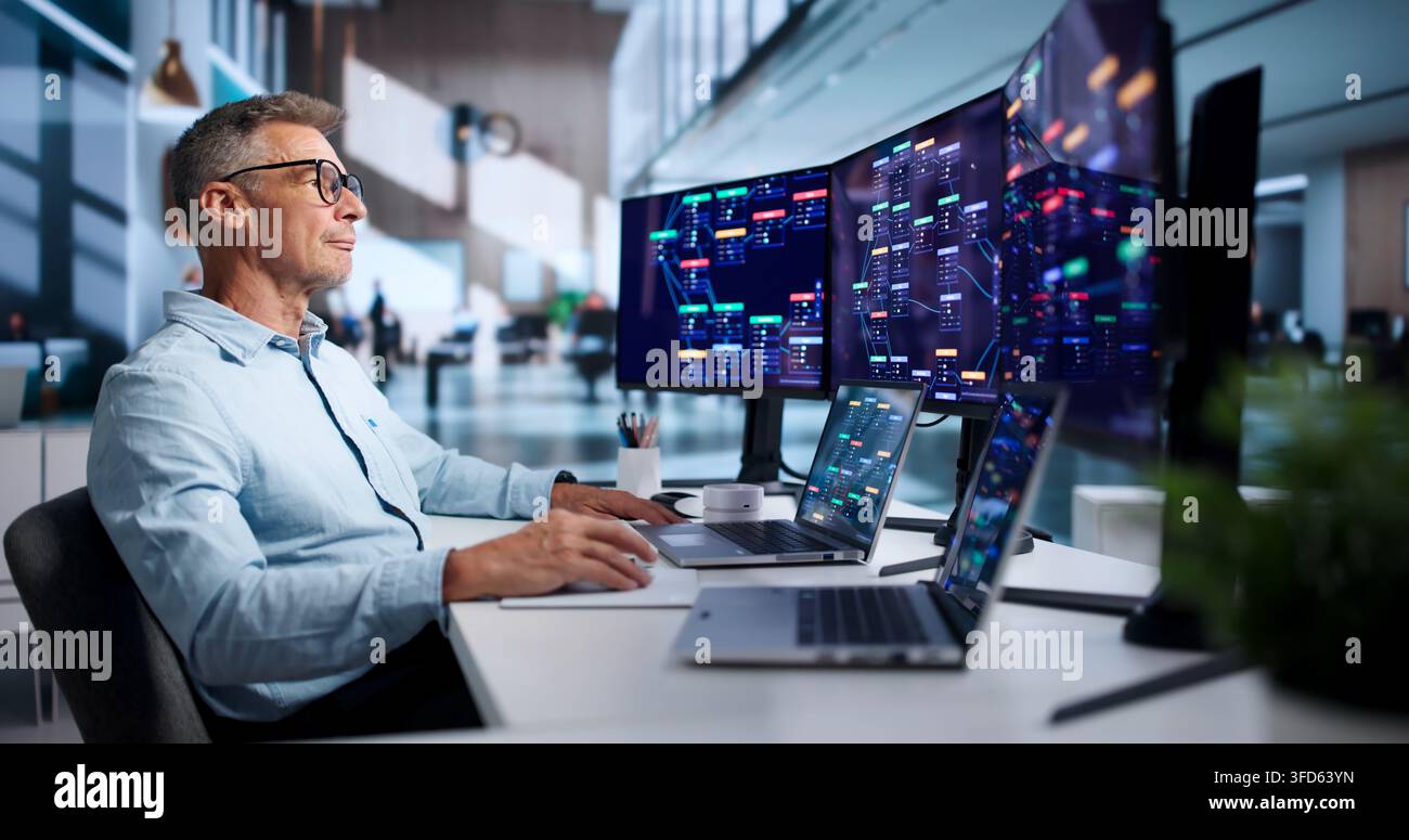 Software Engineer Rapidly Builds Business Apps Using Low Code Platform. Stock Photo