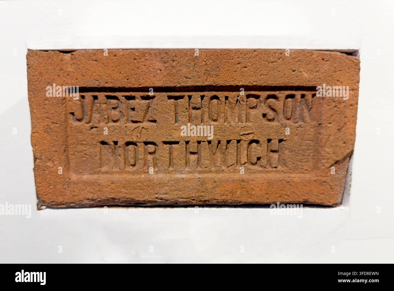 Historic Northwich brick stamped “Jabez Thompson Northwich”. Stock Photo