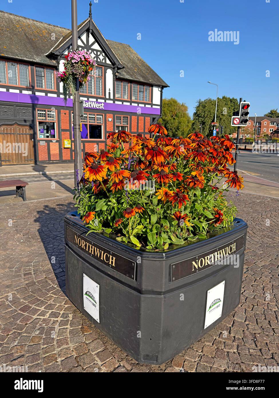 Northwich BID flower planter at the junction of Witton Street and Watling Street near Town Bridge. Stock Photo