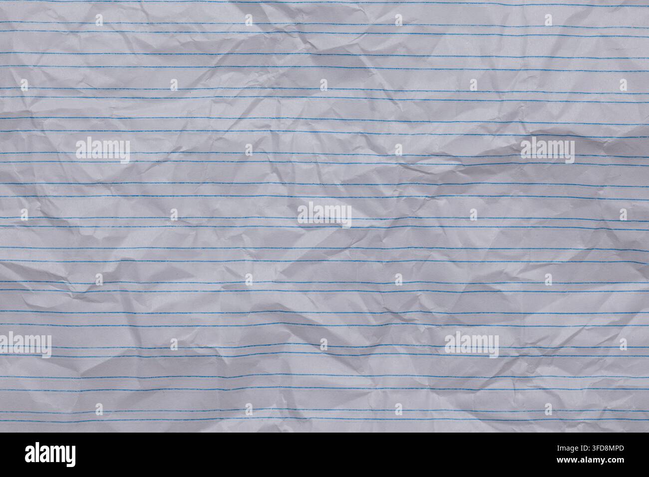 Crumpled white lined paper creating a textured background for various design needs Stock Photo