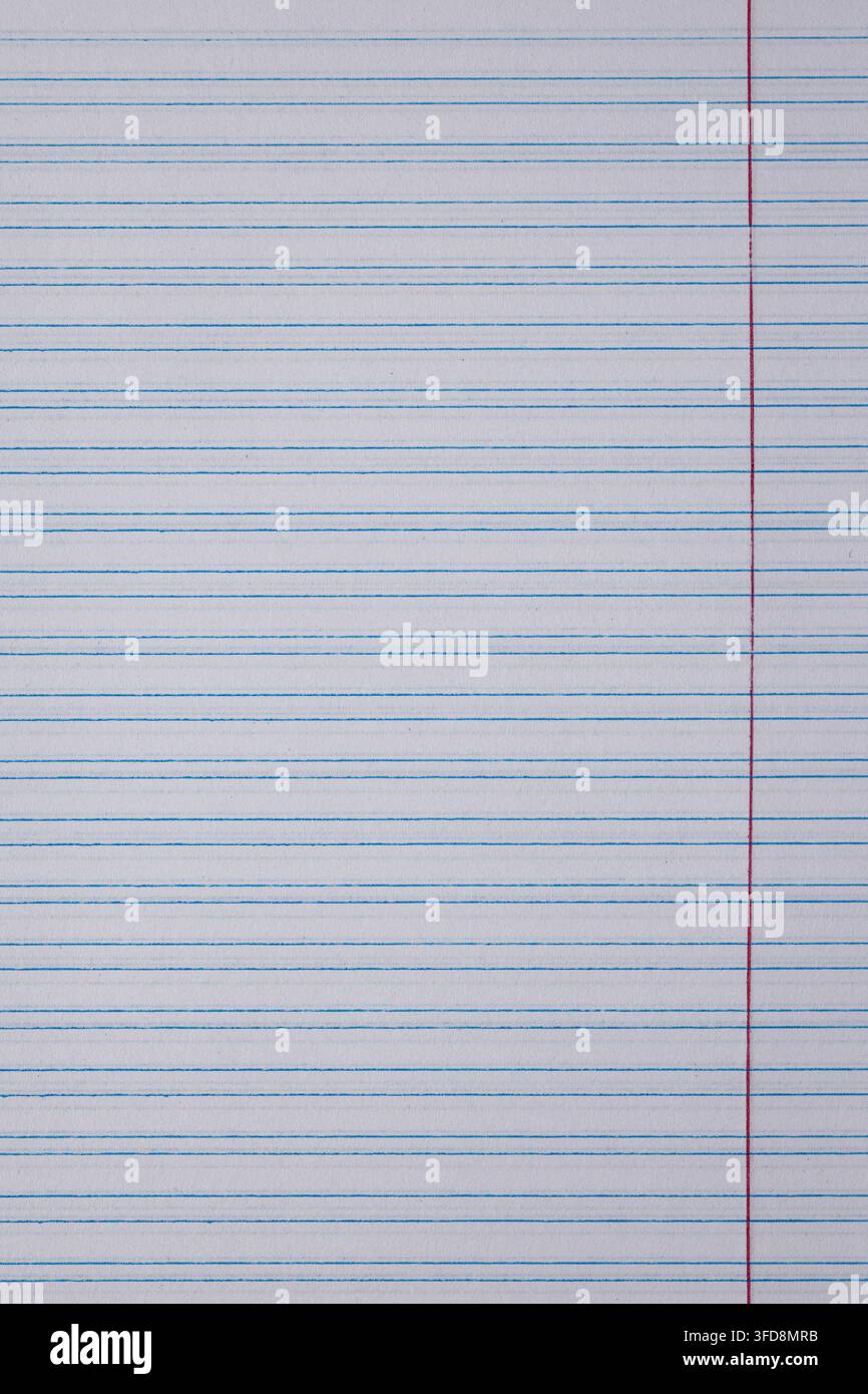 Lined paper texture background showing blue horizontal lines and a red vertical margin Stock Photo