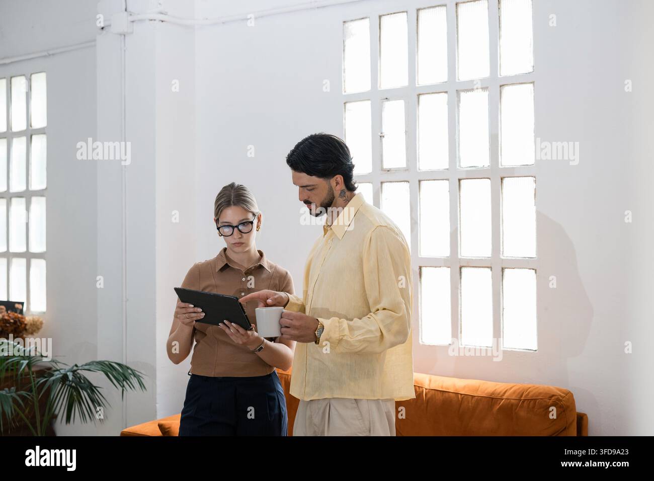 Business colleagues collaborating using digital tablet Stock Photo