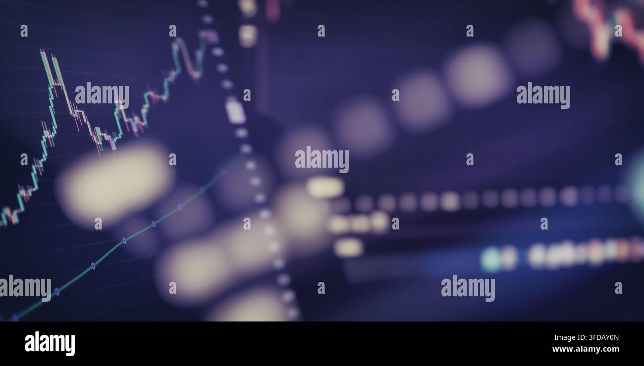 Digital trading dashboard displaying economic data analysis with blurred lights over a dark screen. Stock Photo