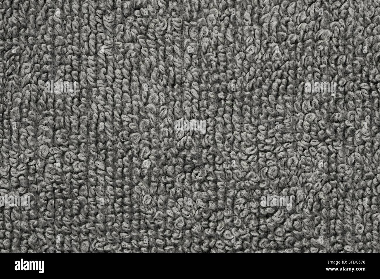Gray terry cloth textile shows a soft, absorbent loop pile fabric texture Stock Photo