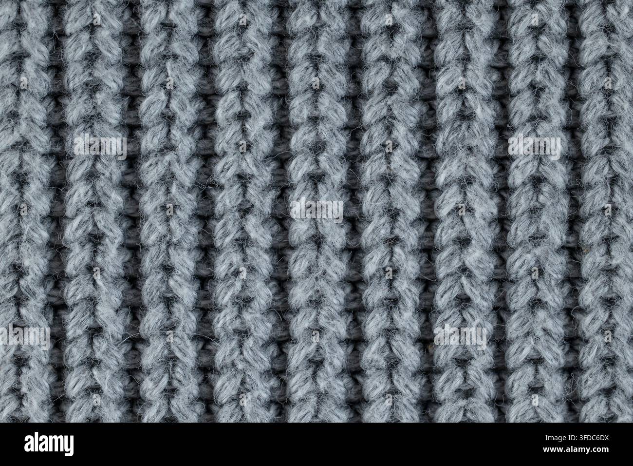 Close-up showing grey ribbed knitted wool fabric texture Stock Photo