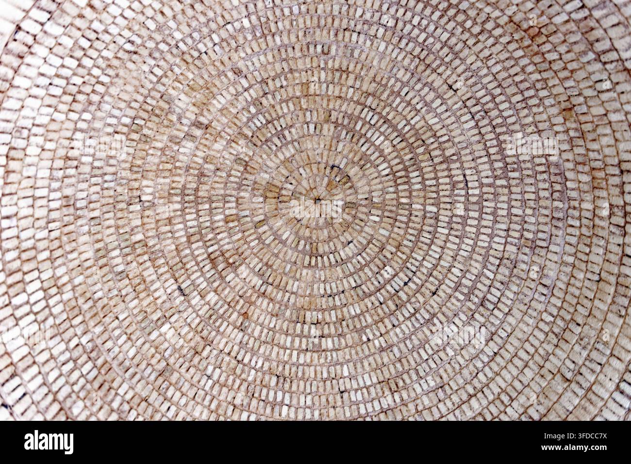 Macro view looking up into an intricate circular concentric brickwork ceiling dome in Hammat-al-Jarid. Photographed on 8.10.2024 Stock Photo