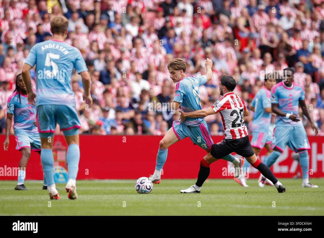 cesar-palacios-of-fulham-beats-enzo-le-fee-of-sunderland-during-the