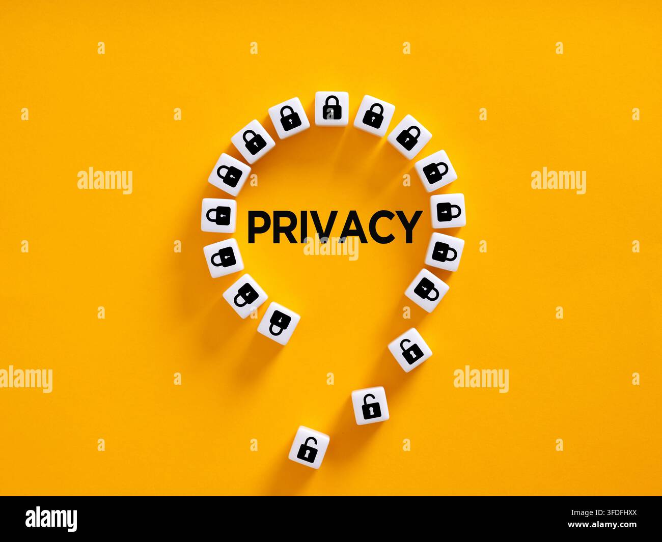 Privacy word written on yellow background with padlocks, some open, representing data vulnerability and security breach risks Stock Photo