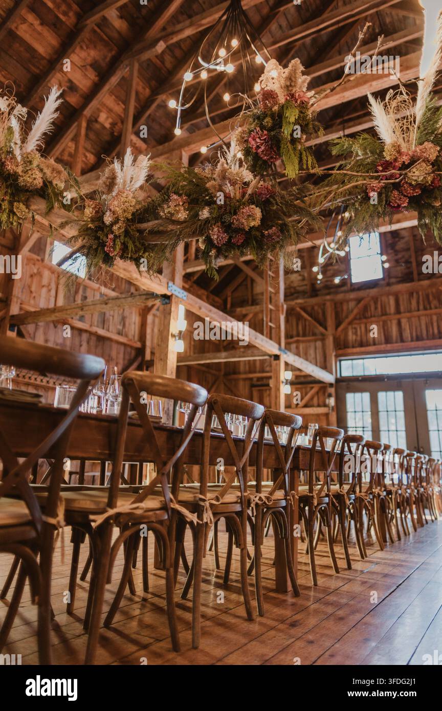 Rustic barn wedding reception table and decor Stock Photo