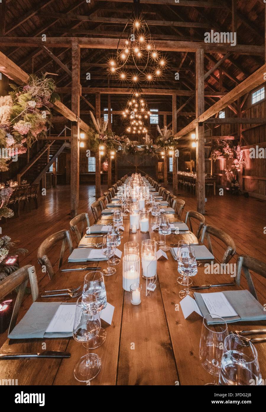 Long rustic dining table set for a wedding Stock Photo